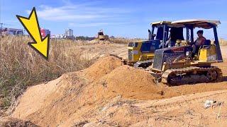 The Powers Machine Two bulldozer Big & Small Pushing the sand together