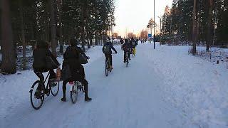 Morning rush: kids cycling to school in winter in Oulu, Finland