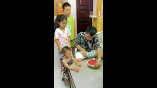 Father cutting the watermelon and son distributing it. #parent-child interaction #Baby children #cu
