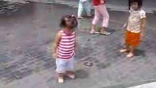 Baby Jamee playing in the fountain