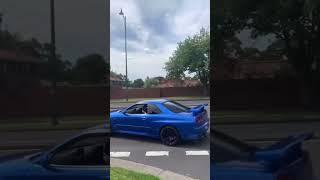 Gtr r34 skyline pulls out of car meet. gtr r34 skyline sound twin turbo drift burnout