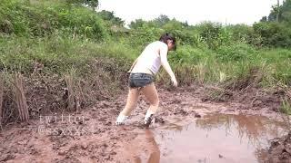 white high canvas shoes in mud