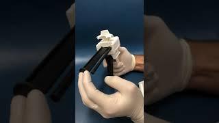 How to load a dental impression gun.