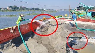 See where the sand is moved from barge ships to dredgers machine 6