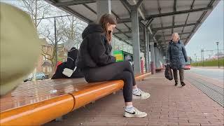 Young girl smoking and littering at the bus stop candid