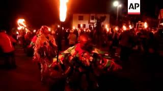 Dancers in elaborate costumes take part in Surva festival to mark new year