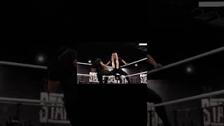 Charlotte Flair receiving a low blow!