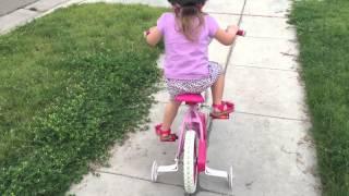 2 year old toddler rides a bike (with training wheels!) cycle