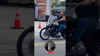 Old Man With Classic Harley Davidson Sportster 1200 On The Street
