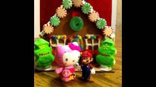 Hello Kitty and Super Mario meet Wonder Woman in front of Gingerbread House