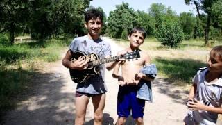 Tajik Kids Try to Play Music