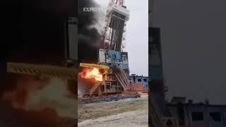 Watch the dramatic moment a flaming Russian oil rig crashes to the ground