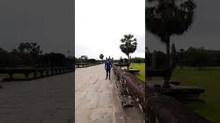 World explorer in Angkor Wat temple Siem Reap Cambodia
