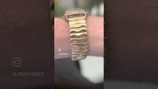 Focusing on a Vintage Longines tank-style watch from 1951