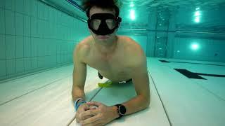 Man holding breath underwater