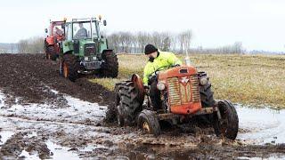 Vintage Tractors Plowing in Wet Condition