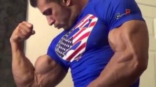 big bodybuilder flex huge hard muscles