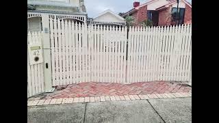 Timber Picket Trackless Bi-fold Automatic Gate - by The Motorised Gate Company