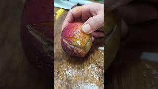The process of cutting plums with a knife