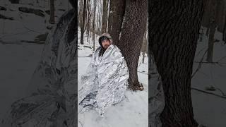 Pocket sized heated survival shelter