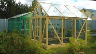 A simple greenhouse made of glass and wood with your own hands