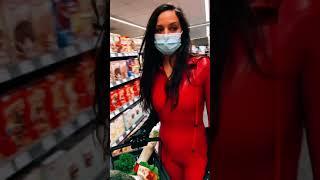 MODEL GIRL IN LATEX IN PUBLIC food shopping in red catsuit and latexgloves