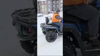 driving quad in front of the building