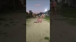 Eny Kate walking the bike