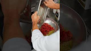 Crafting the perfect Twiga beef Tacos at Twiga Monte Carlo Restaurant