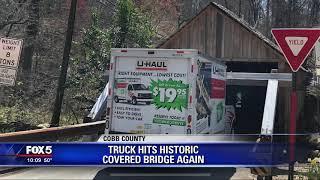 Truck hits historic covered bridge again