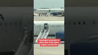 Passengers evacuate on slides after Delta plane catches fire #shorts