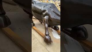 Bronze wall street bull sculpture