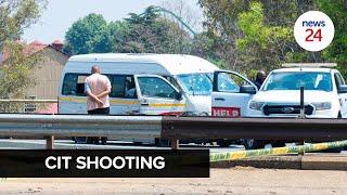 WATCH | Joburg CIT shooting: Robber's body lay uncovered on the road next to bullet-riddled taxi