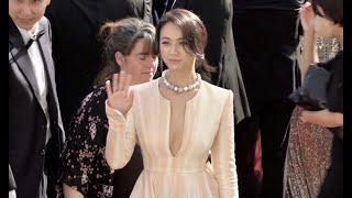 Tang Wei gives some love to her fans before walking the red carpet in Cannes