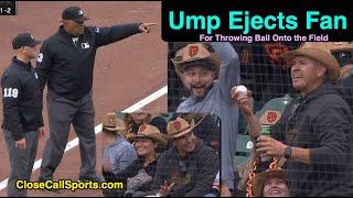 Umpire Ejects Fan Who Threw Ball Onto Field, Nearly Hitting Crew Chief Laz Diaz at 2nd Base