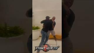 ISRAEL ADESANYA & JON JONES SPAR AFTER MEETING; BOTH GRAPPLE IN CLINCH!