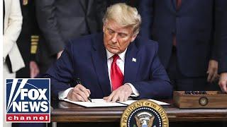 Trump signs executive orders from Oval Office