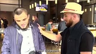 Umar Nurmagomedov and Merab Dvalishvili size each other up in a hotel.