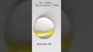 Crystals in a drop: Pb(NO3)2 + KI lead nitrate and potassium iodide crystals in a drop of water