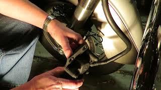 Kawasaki 900 front brake pad replacement.