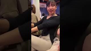 Woman Hides Belly at Restaurant