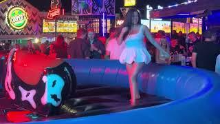 OMG!  GIRL IN DRESS ON A BULL  BENIDORM BULL RIDING. Spain