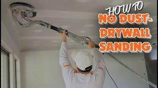 Sanding with an electric drywall vacuum sander