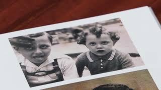 Holocaust survivor Manfred Goldberg tells his story to two of his grandchildren.