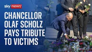 German Chancellor Olaf Scholz pays tribute to victims of festival stabbing