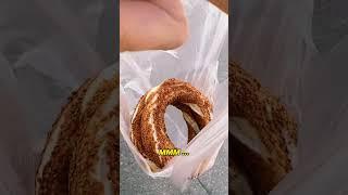 Buying and trying Turkish Simit! Very tasty!