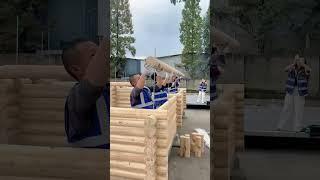 Craftsmen use building blocks to build a wooden house