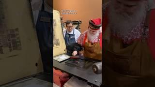 @SantaJClaus stops by the print shop at our Museum and prints an image of himself.