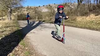 Riding Micro Sprite Scooters