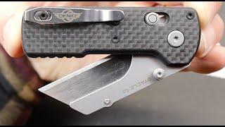 Olight Oknife Otacle U1 Carbon Fiber Crossbar Lock Utility Knife: A black tie worthy utility knife!